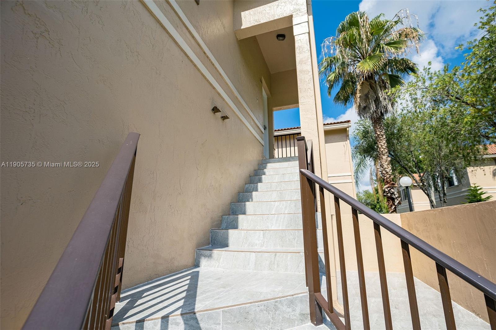 15865 Southwest 6th Place, Unit 201 Pembroke Pines, FL 33027 - Photo 53 of 80 a view of staircase with railing and white walls