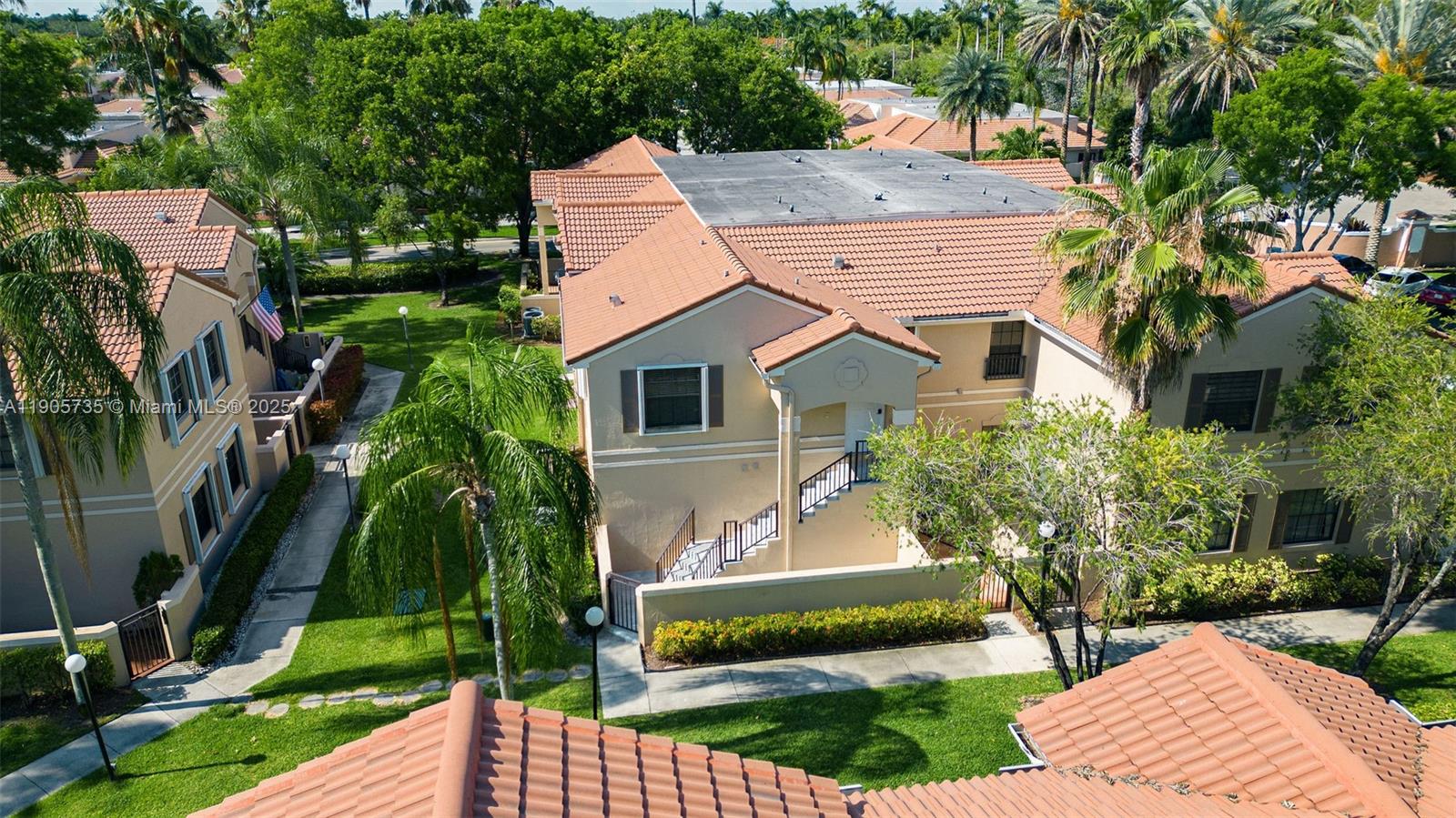 15865 Southwest 6th Place, Unit 201 Pembroke Pines, FL 33027 - Photo 65 of 80 a aerial view of a house with a yard and potted plants