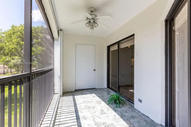 a bathroom with double sink and two mirror