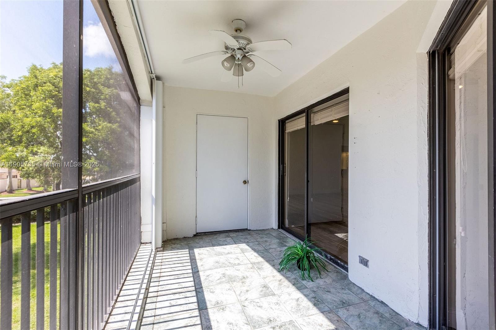 15865 Southwest 6th Place, Unit 201 Pembroke Pines, FL 33027 - Photo 9 of 80 a view of a balcony with a ceiling fan