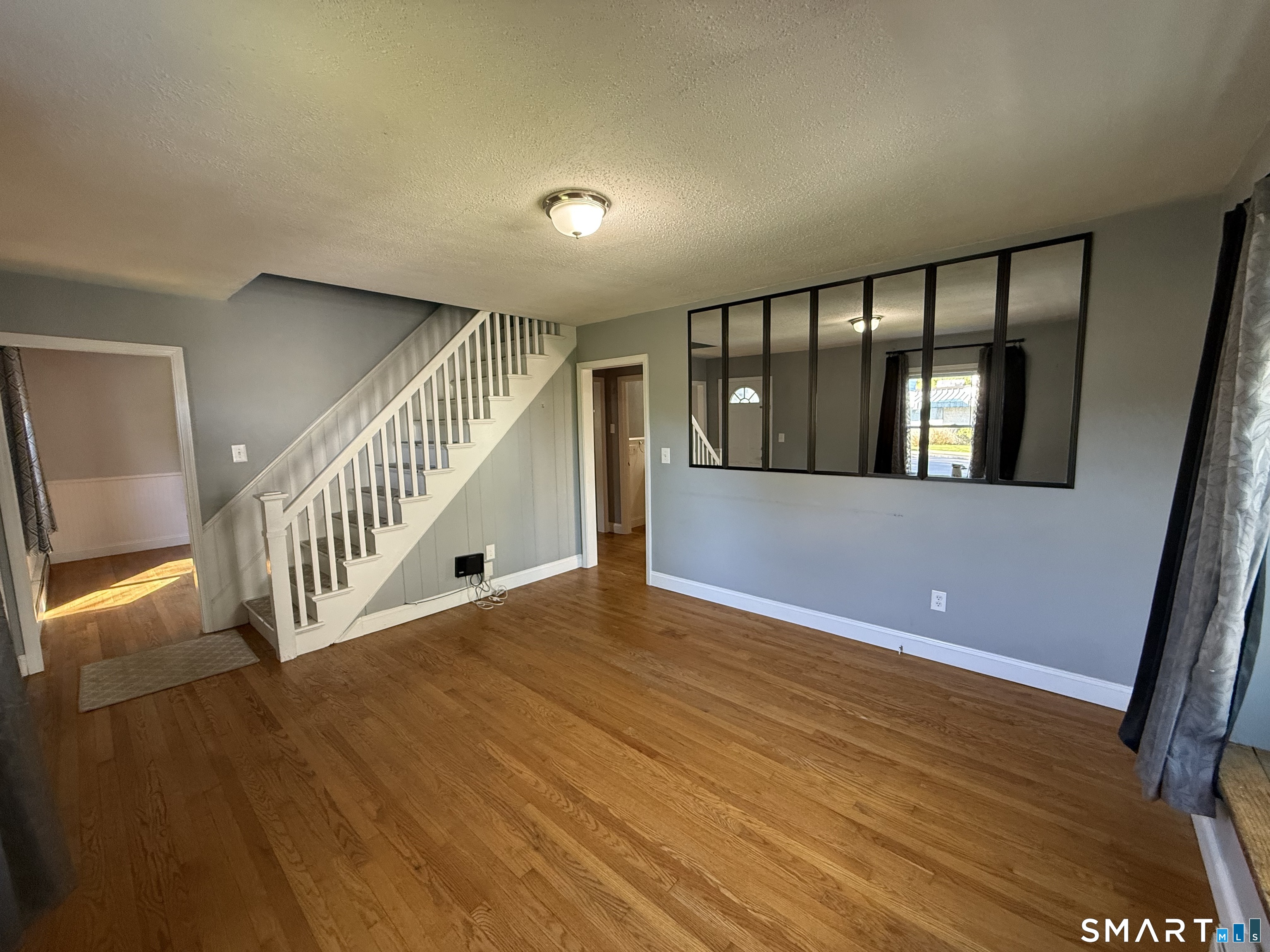 808 East Main Street Torrington, CT 06790 - Photo 24 of 40 a view of staircase with lots of wooden floor and windows