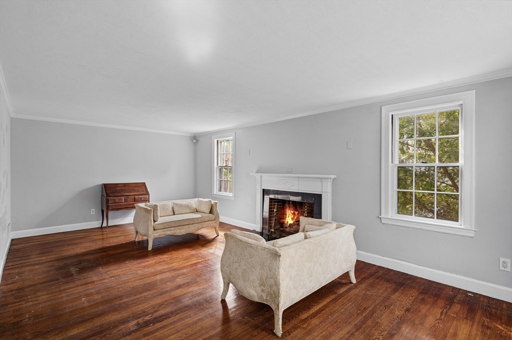 26 Pickwick Road Marblehead, MA 01945 - Photo 9 of 40 a living room with furniture and a fireplace