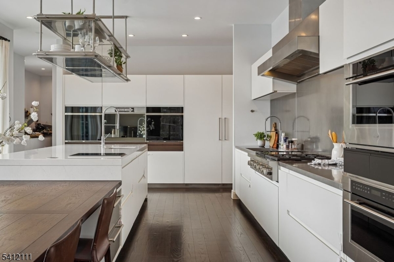 89 Mosle Road Peapack-Gladstone, NJ 07931 - Photo 13 of 45 a kitchen with stainless steel appliances granite countertop a sink a stove and cabinets