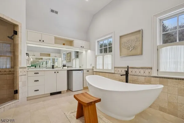 a living room with furniture and a kitchen island