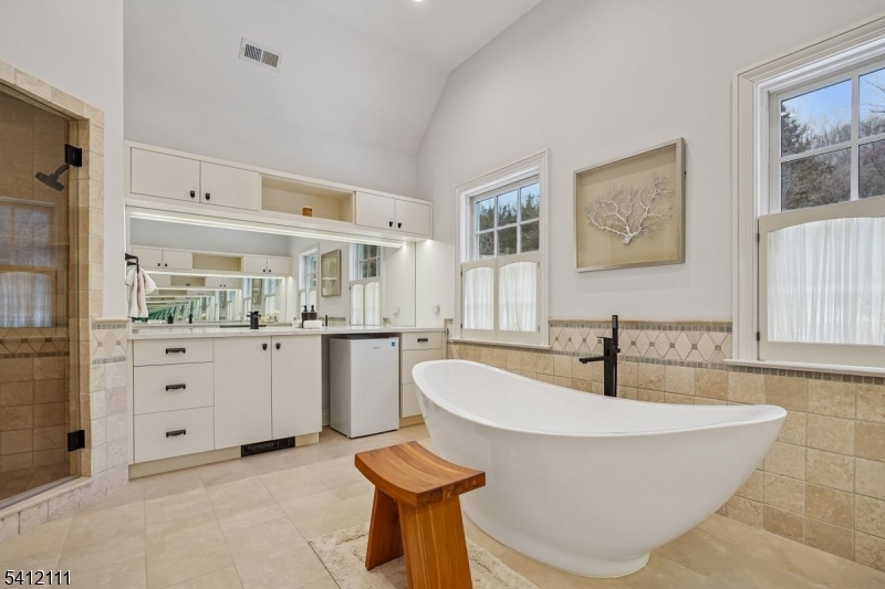 89 Mosle Road Peapack-Gladstone, NJ 07931 - Photo 19 of 45 a living room with furniture and a kitchen island