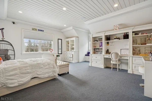 a bed room with a bed and a large window