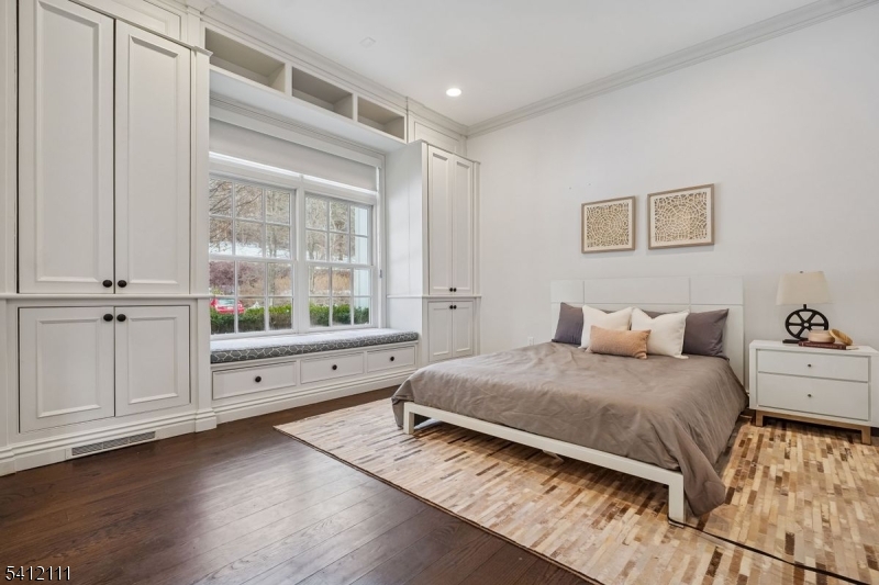 89 Mosle Road Peapack-Gladstone, NJ 07931 - Photo 25 of 45 a bedroom with a bed and a window