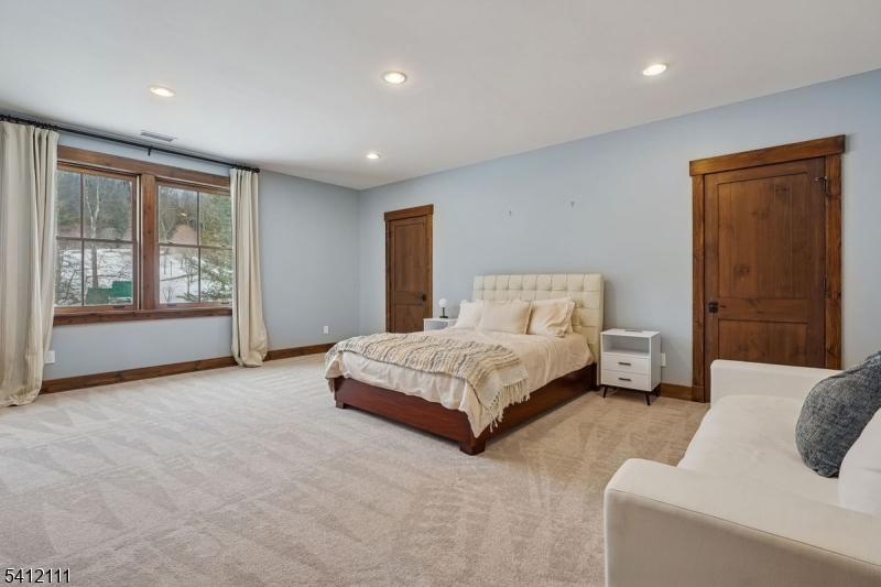 89 Mosle Road Peapack-Gladstone, NJ 07931 - Photo 41 of 45 a bedroom with a large bed and a couch