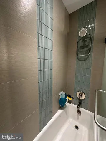 a bathroom with a sink and a shower