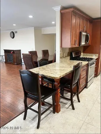 a view of kitchen with breakfast area