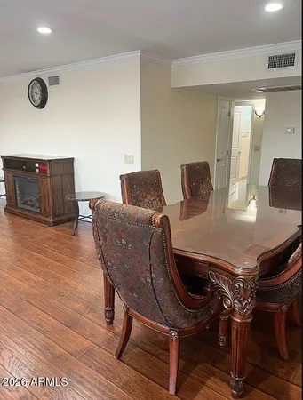 a view of a dining room with furniture and wooden floor