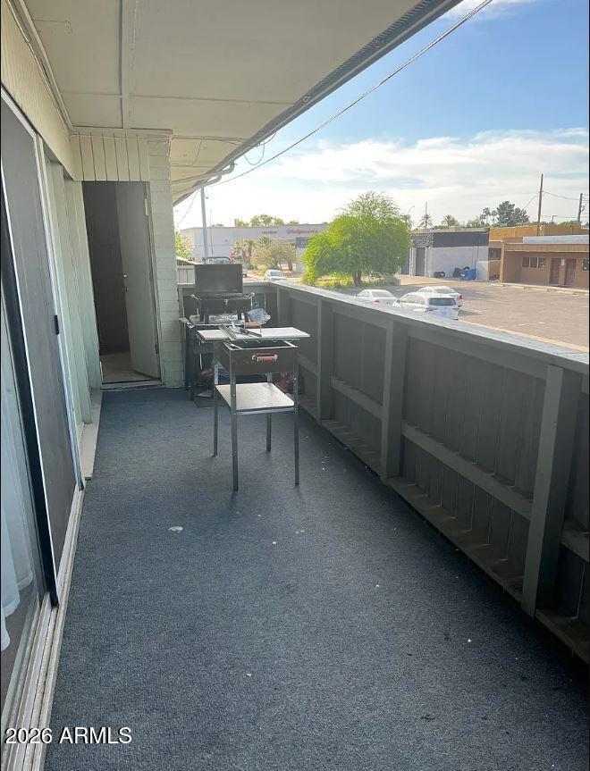 6767 North 7th Street, Unit 221 Phoenix, AZ 85014 - Photo 9 of 9 a living room with stainless steel appliances granite countertop furniture a refrigerator a sink a stove and a refrigerator
