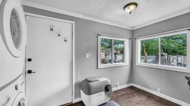 a view of a livingroom with furniture and windows
