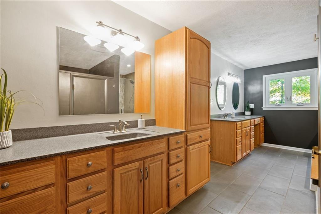 114 Will Scarlet Road Canonsburg, PA 15317 - Photo 11 of 14 a spacious bathroom with a double vanity sink and a mirror
