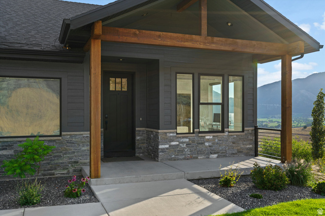 4499 North Seven Bridges Road, Unit 9 Eden, UT 84310 - Photo 60 of 65 Covered front entry featuring wood pillars and stone accents