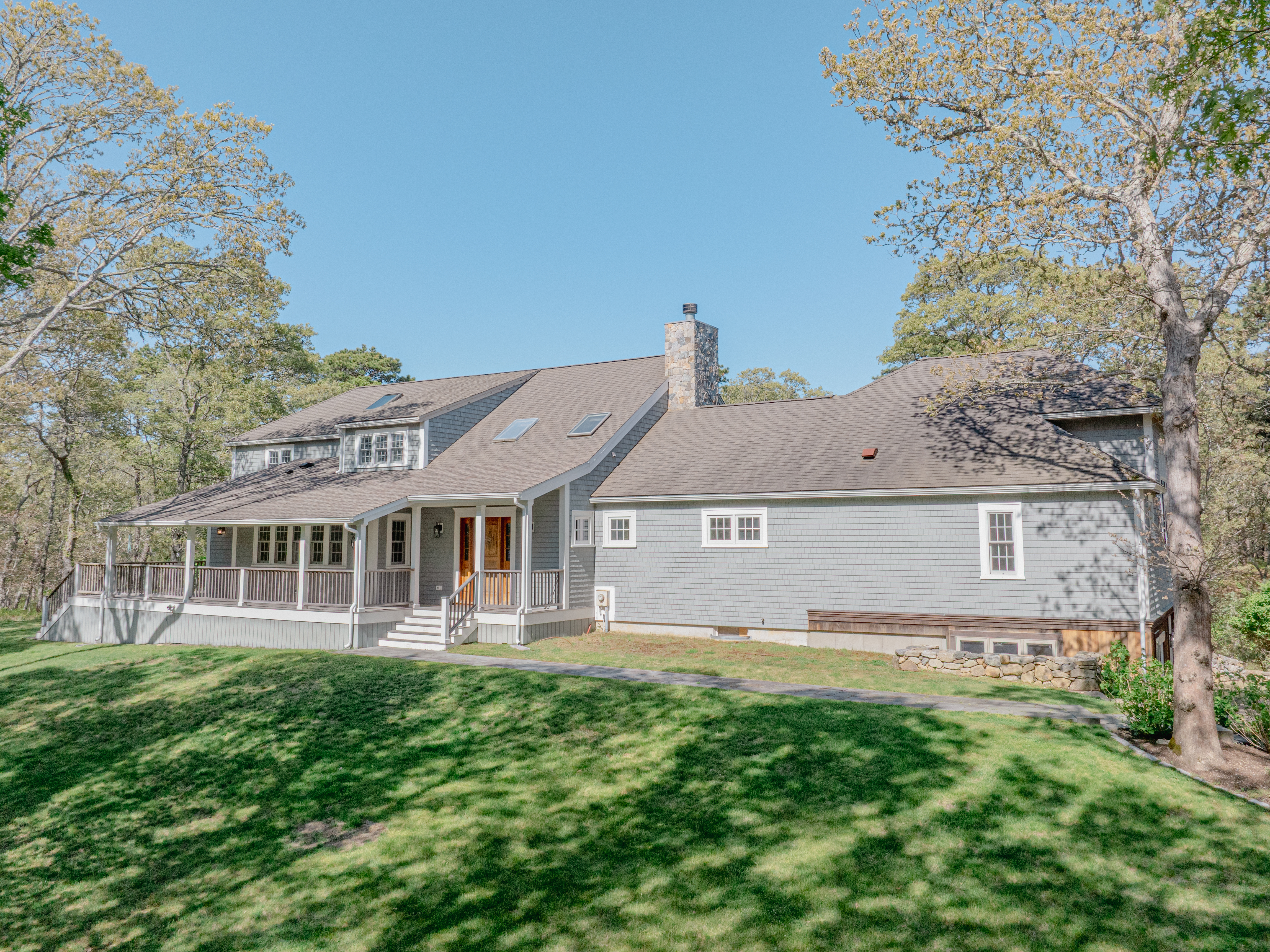63 Bayes Hill Road Oak Bluffs, MA 02557 - Photo 20 of 60 front view of a house with a yard
