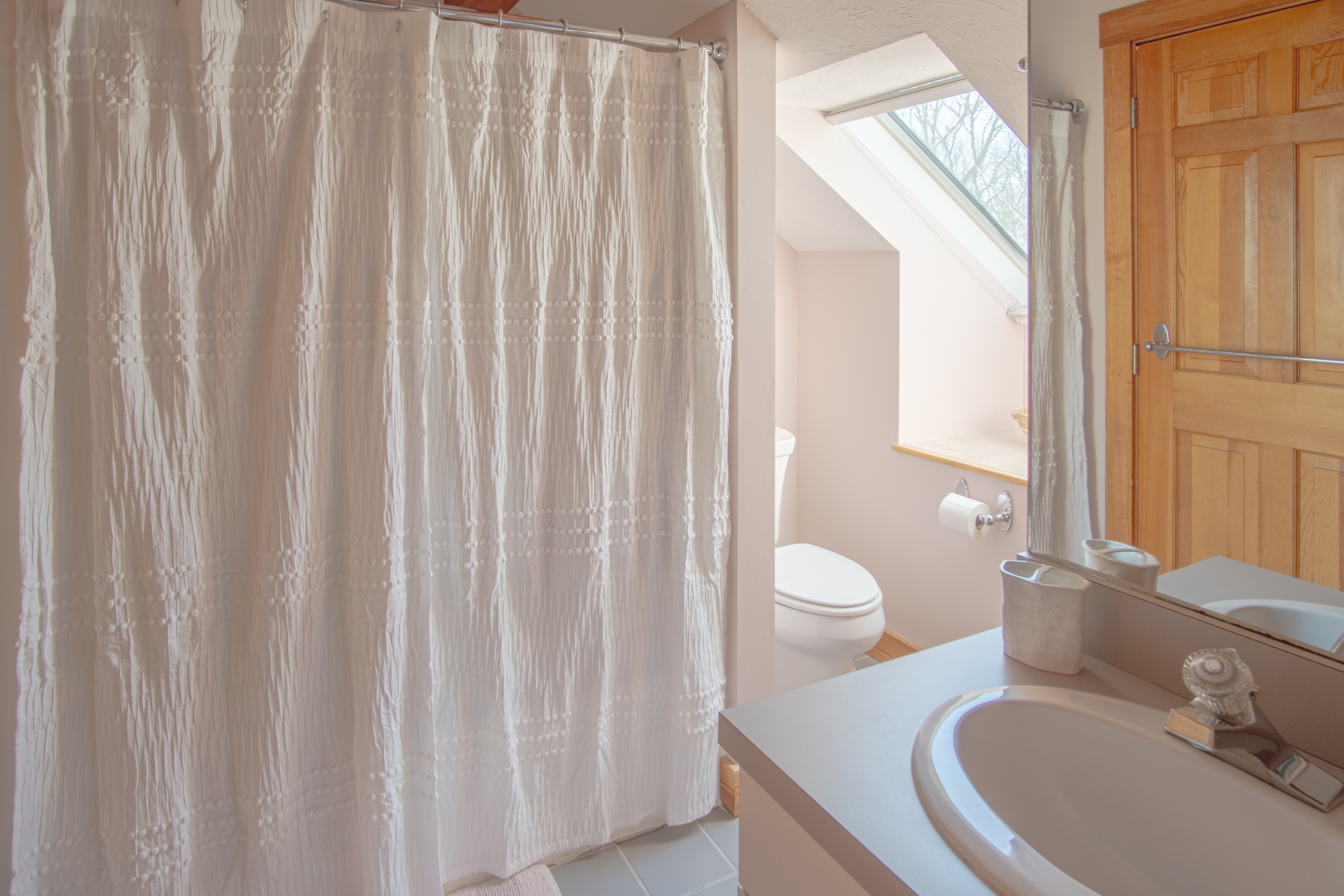 63 Bayes Hill Road Oak Bluffs, MA 02557 - Photo 47 of 60 a bathroom with a granite countertop sink and a mirror