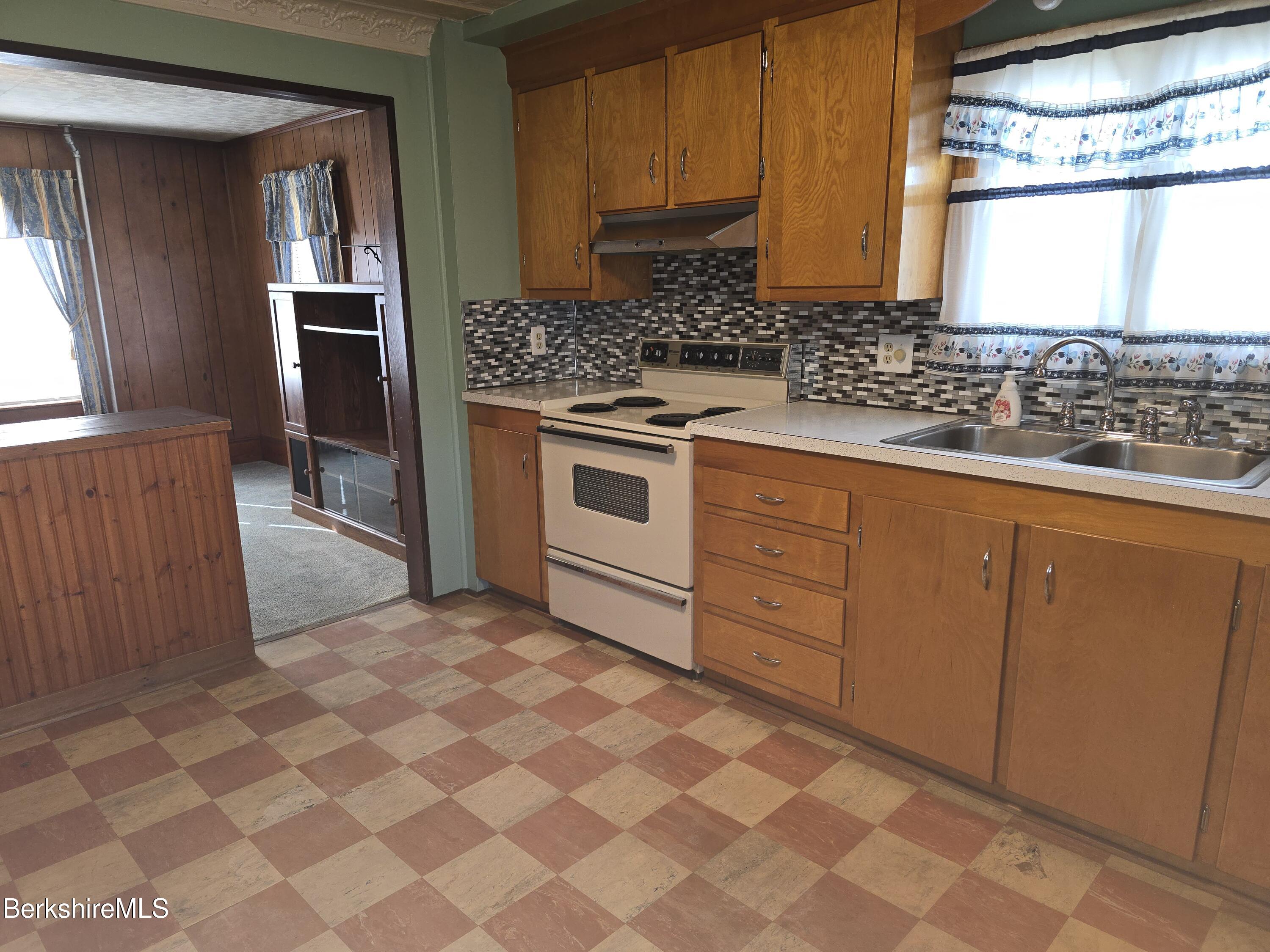 1 Godek Street Adams, MA 01220 - Photo 11 of 51 a kitchen with stainless steel appliances a sink and a stove