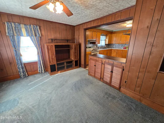 a view of an empty room and a window