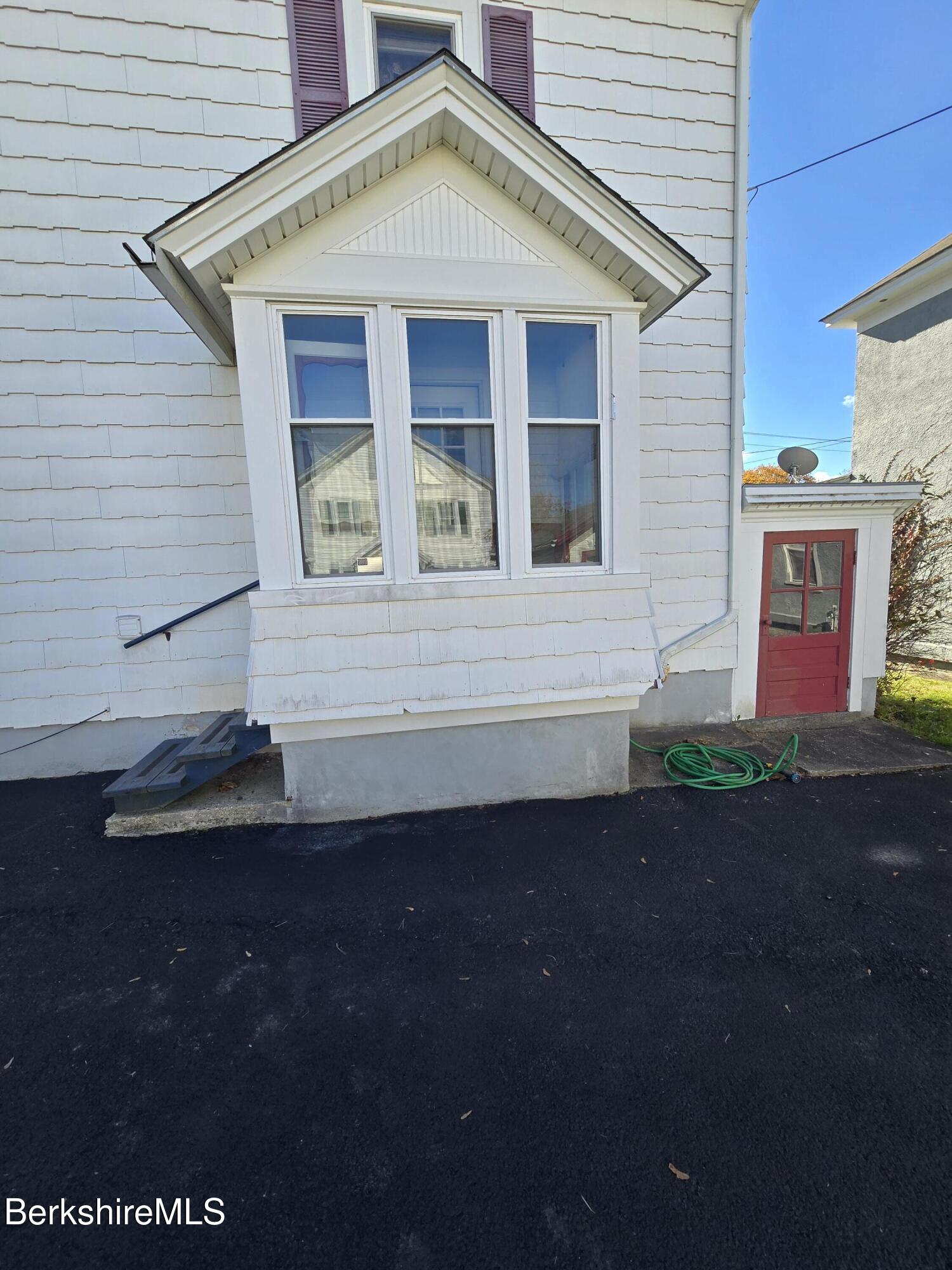 1 Godek Street Adams, MA 01220 - Photo 8 of 51 a front view of a house with garden