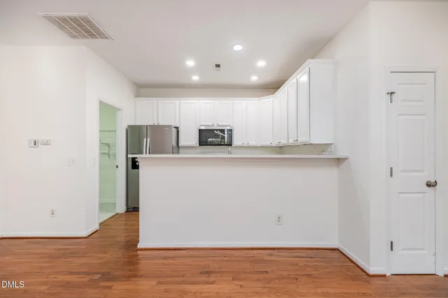 a view of a kitchen with a sink and dishwasher