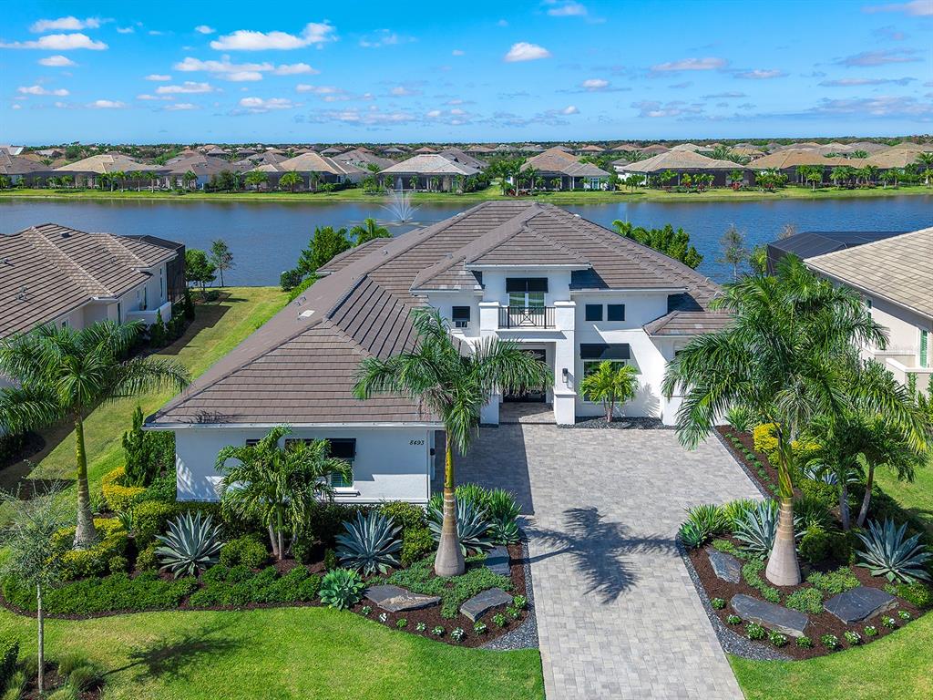 8493 Pavia Way Lakewood Ranch, FL 34202 - Photo 1 of 1 a front view of a house with a yard and lake view