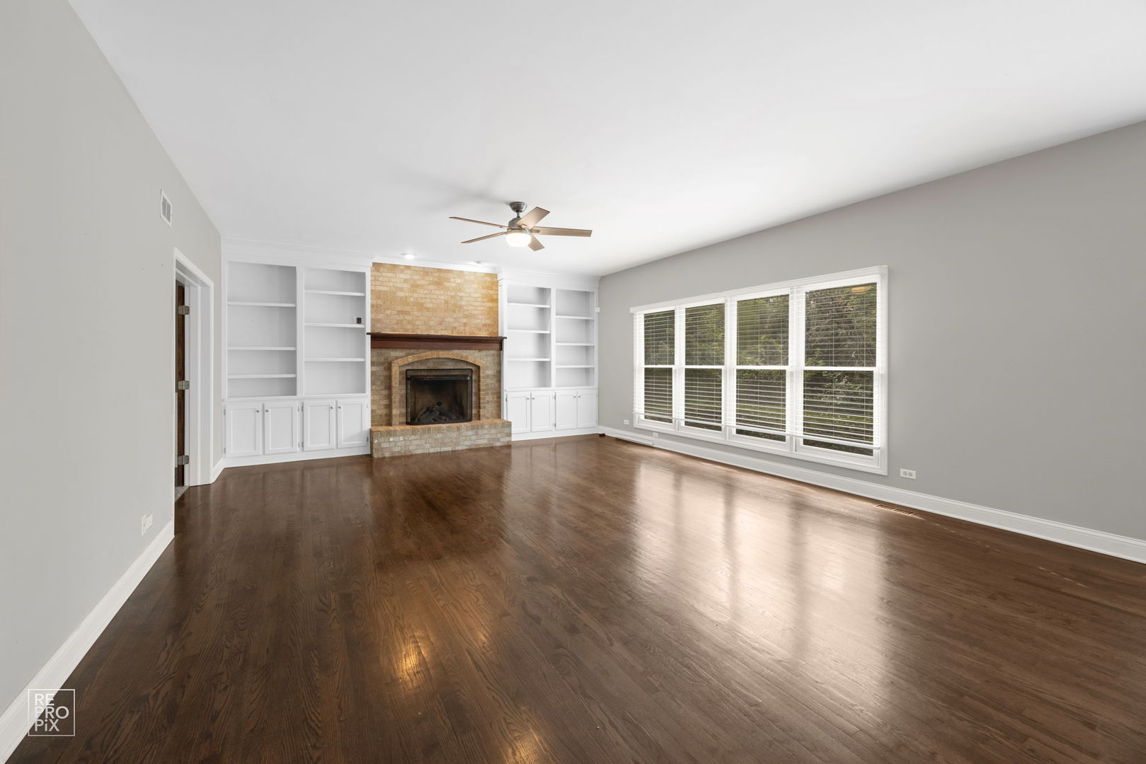 602 Bailey Drive Batavia, IL 60510 - Photo 11 of 26 a view of an empty room with wooden floor and a window