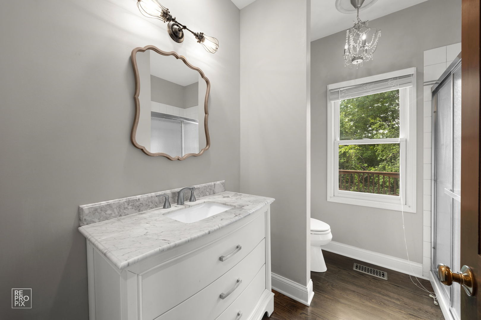 602 Bailey Drive Batavia, IL 60510 - Photo 13 of 26 a bathroom with a granite countertop sink a toilet and a mirror