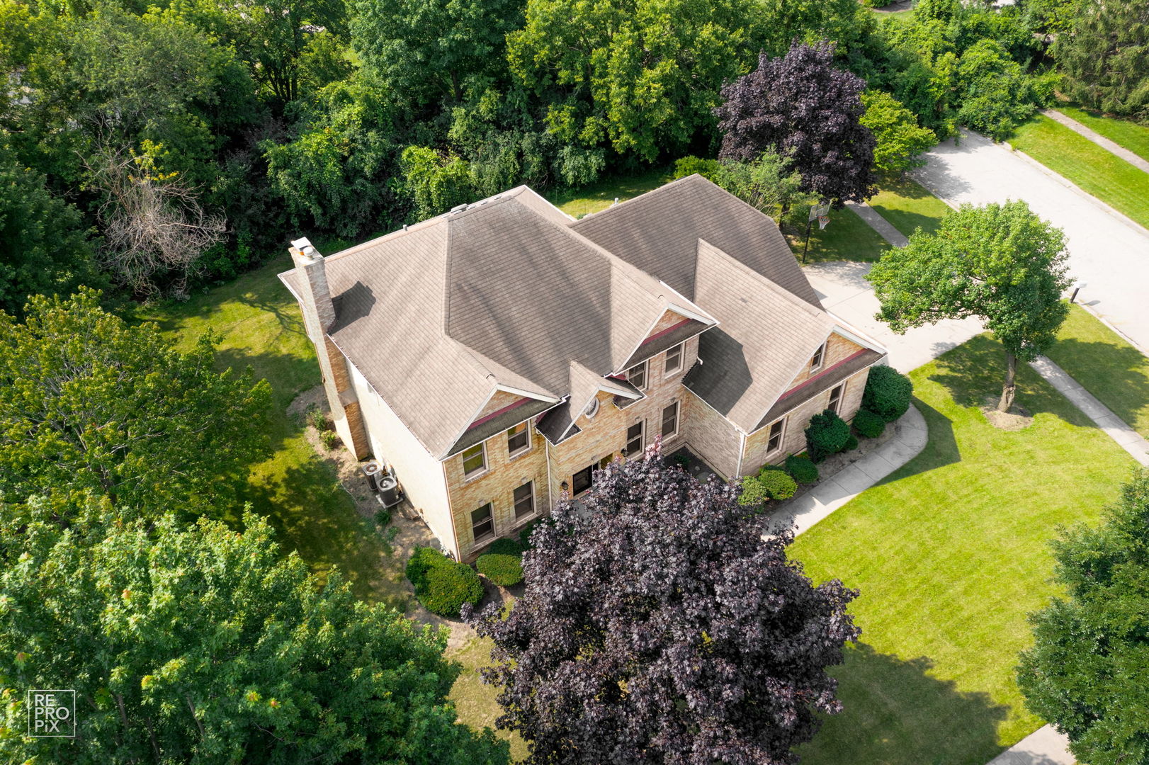602 Bailey Drive Batavia, IL 60510 - Photo 2 of 26 an aerial view of a house with a yard and trees