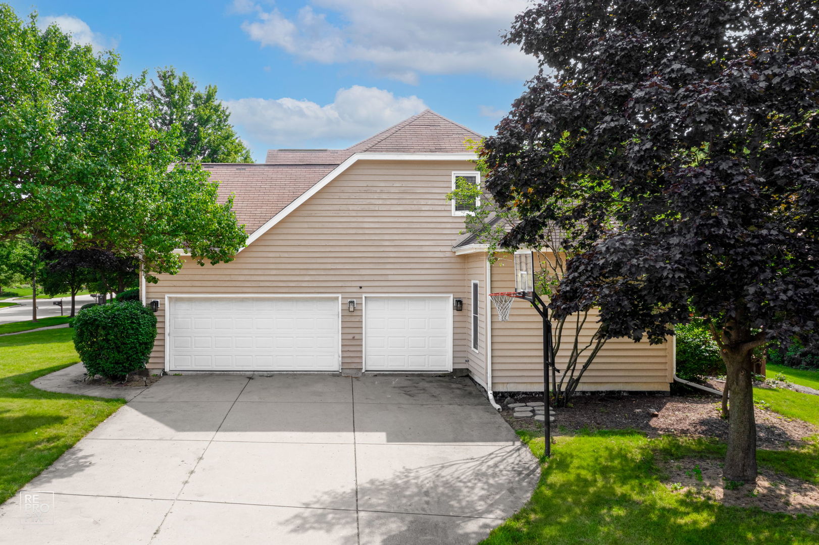 602 Bailey Drive Batavia, IL 60510 - Photo 6 of 26 a view of a white house with a yard and a large tree