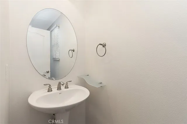 a bathroom with a sink and mirror