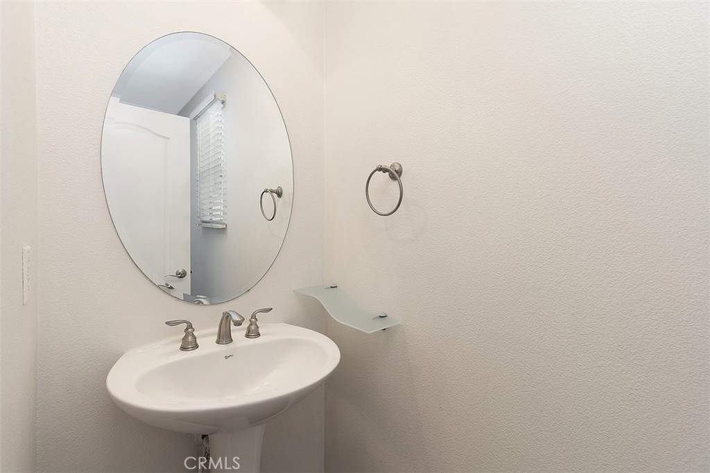 96 Talisman, Unit 23 Irvine, CA 92620 - Photo 16 of 43 a bathroom with a sink and mirror