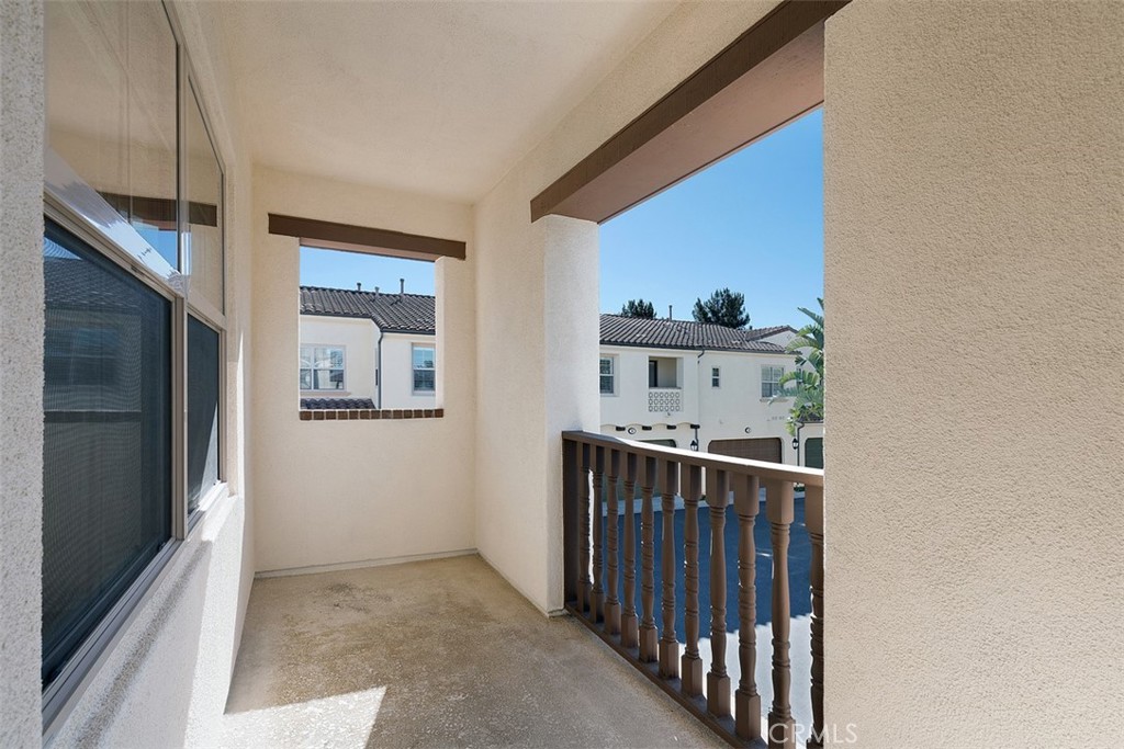 96 Talisman, Unit 23 Irvine, CA 92620 - Photo 26 of 43 a view of a hallway to a livingroom with furniture