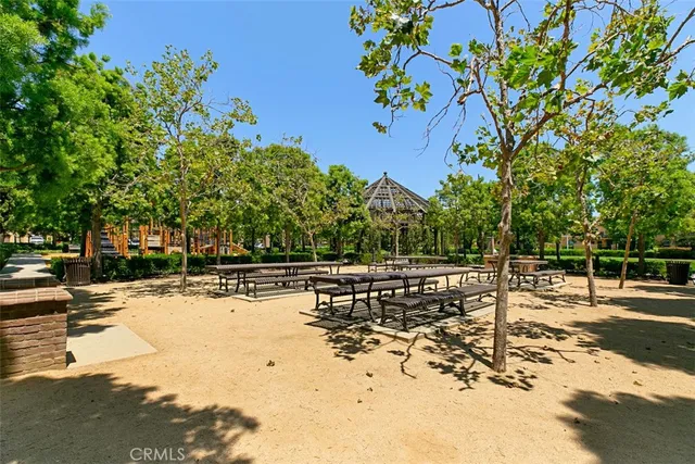 a view of a yard with wooden fence