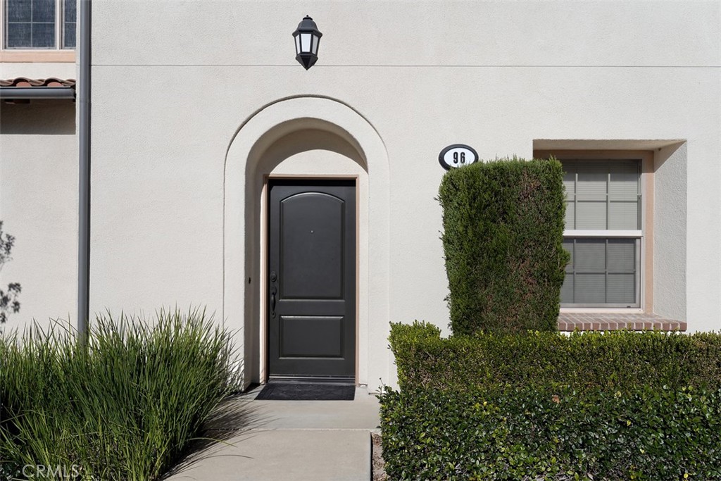 96 Talisman, Unit 23 Irvine, CA 92620 - Photo 4 of 43 a view of front door of house