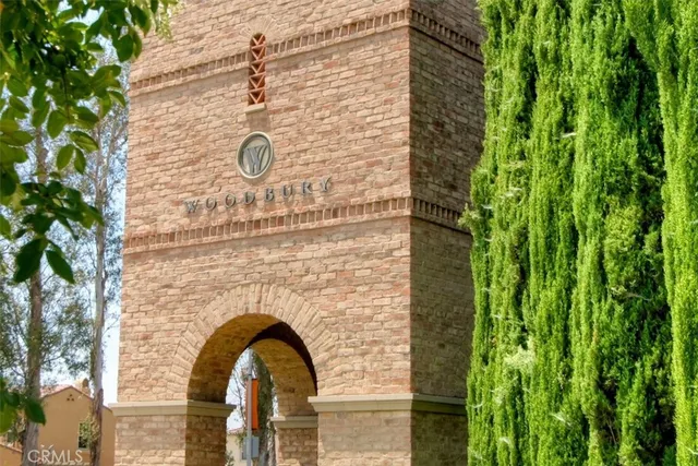 a front view of a house with plants