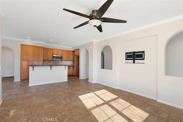 a view of a kitchen with a sink and cabinets
