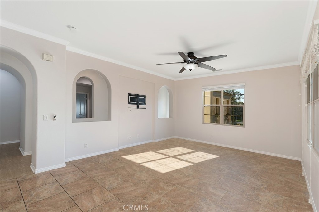 96 Talisman, Unit 23 Irvine, CA 92620 - Photo 8 of 43 a view of a livingroom with a ceiling fan and window