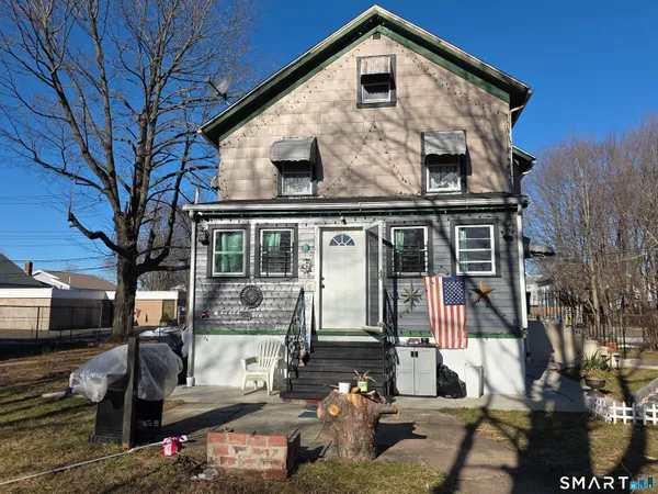 a front view of a house with parking space