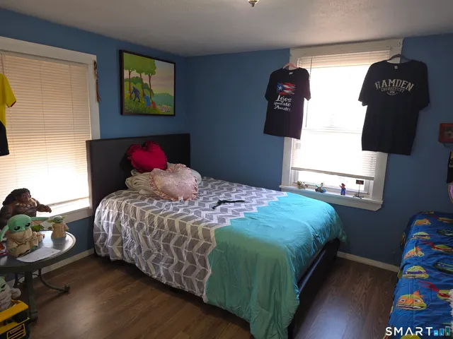 a bedroom with a bed and dresser