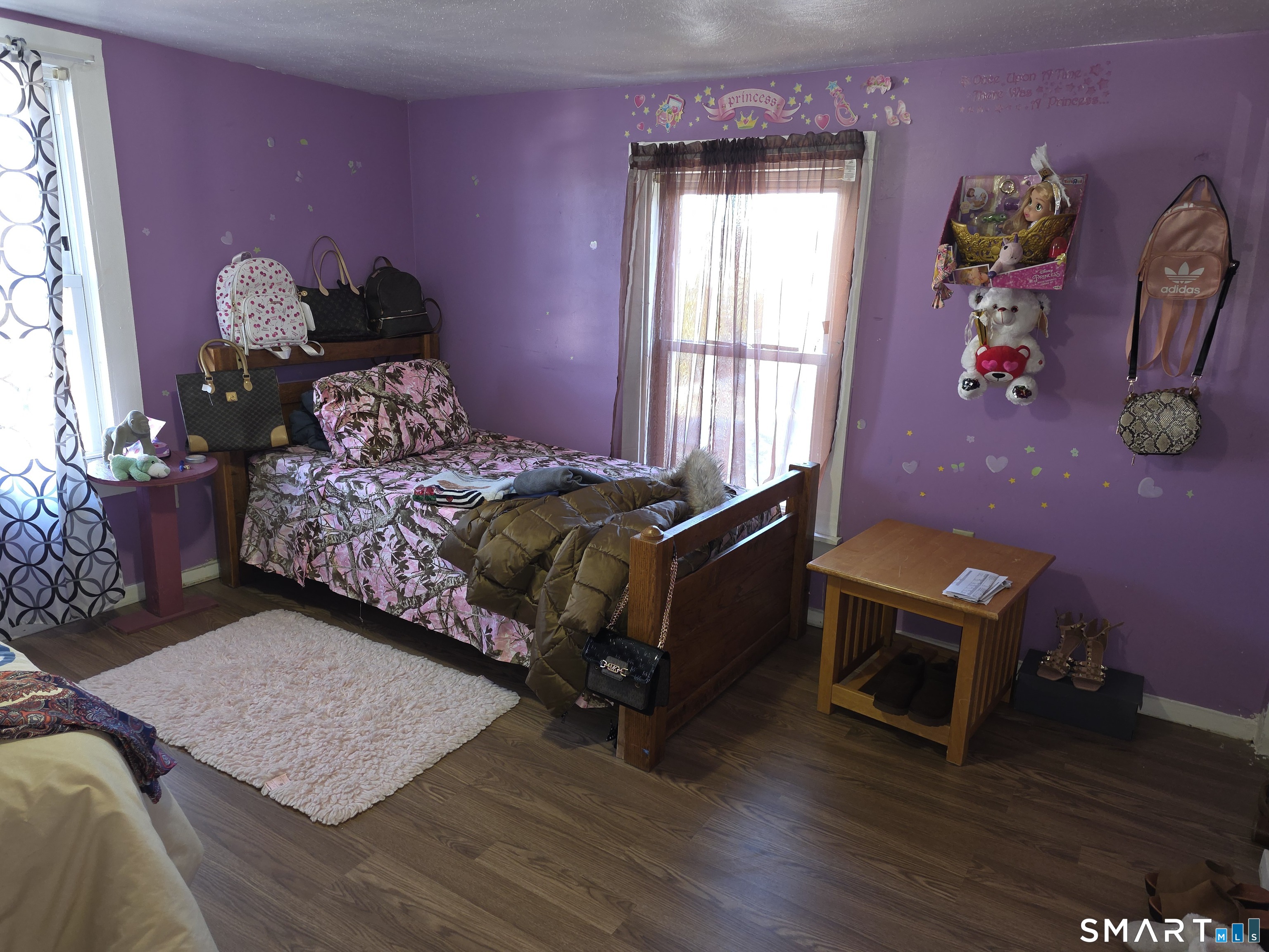 48 Alling Street Hamden, CT 06517 - Photo 17 of 23 a bedroom with a bed and wooden floor