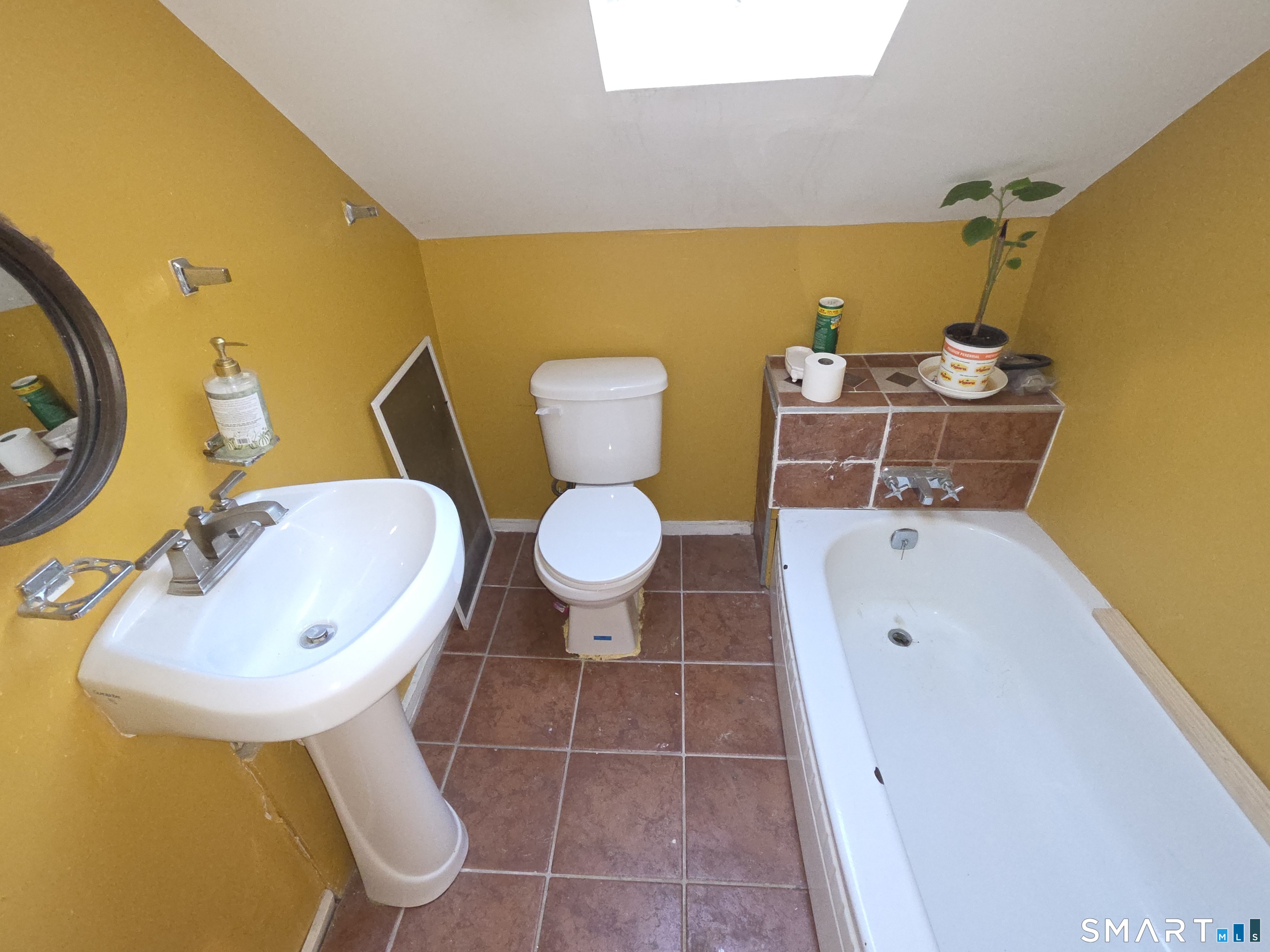 48 Alling Street Hamden, CT 06517 - Photo 18 of 23 a bathroom with a sink mirror and toilet