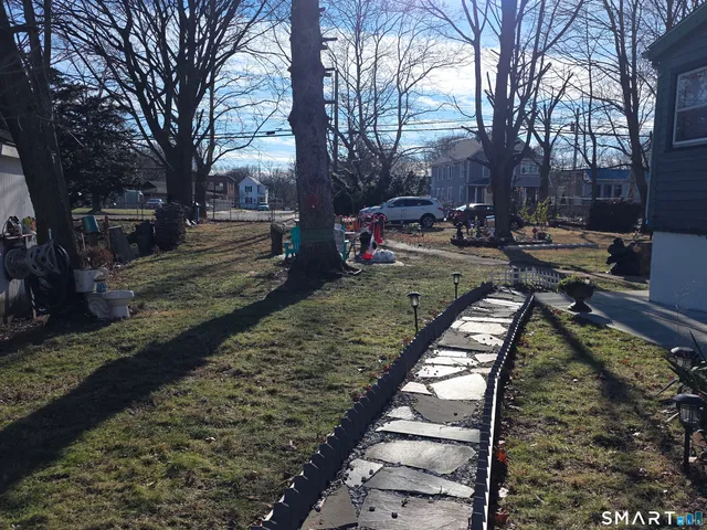 a view of a yard with trees