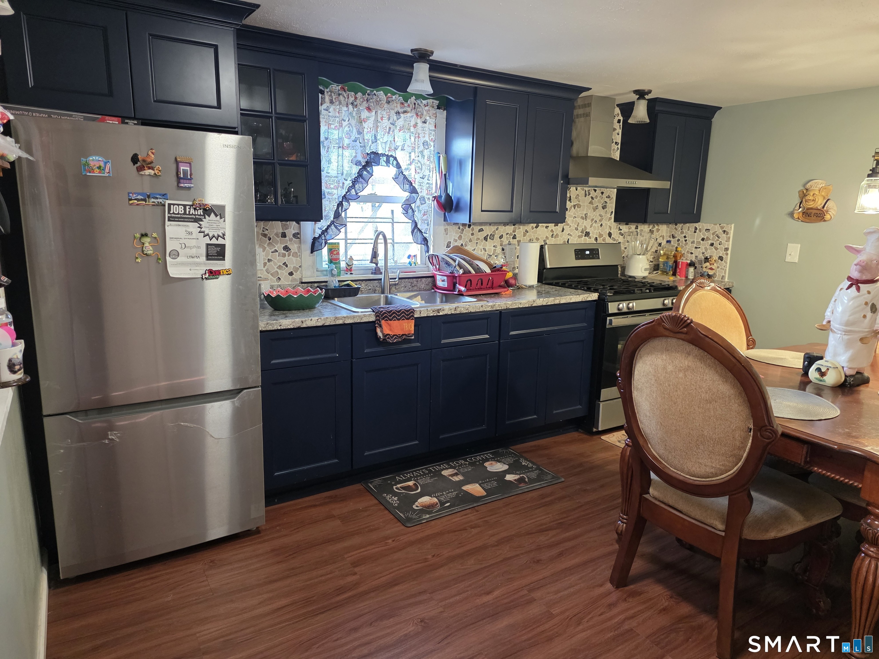 48 Alling Street Hamden, CT 06517 - Photo 7 of 23 a kitchen with granite countertop a refrigerator a stove and wooden floor