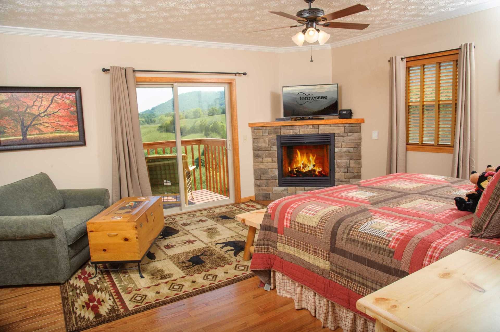 2149 Seaton Springs Road Sevierville, TN 37862 - Photo 17 of 26 a bedroom with a bed and a fireplace