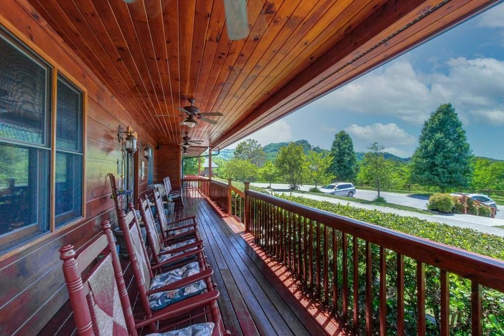 2149 Seaton Springs Road Sevierville, TN 37862 - Photo 24 of 26 a view of a balcony with chairs and wooden fence