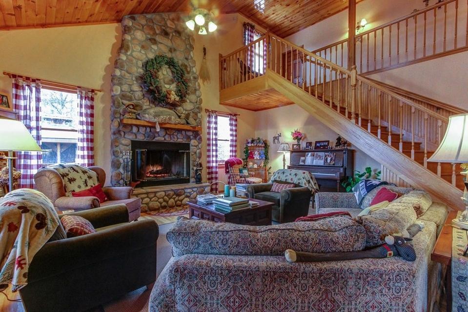 2149 Seaton Springs Road Sevierville, TN 37862 - Photo 9 of 26 a living room with furniture and a fireplace