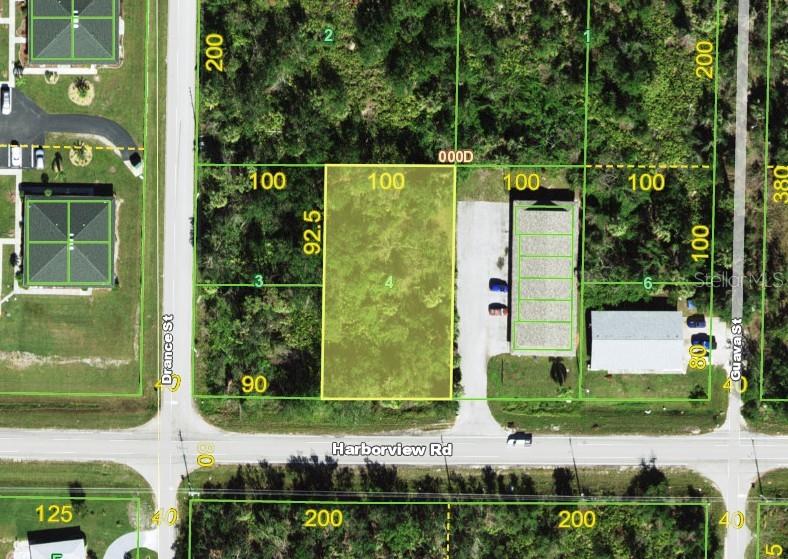 25018 Harbor View Road Punta Gorda, FL 33980 - Photo 3 of 12 front view of a house with a garden