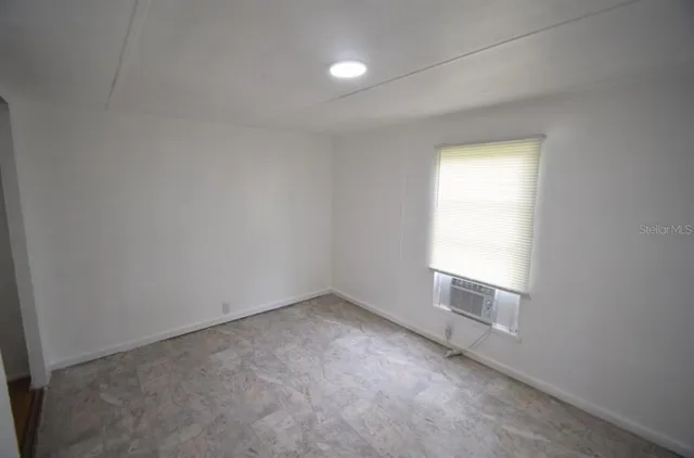 an empty room with a bathroom