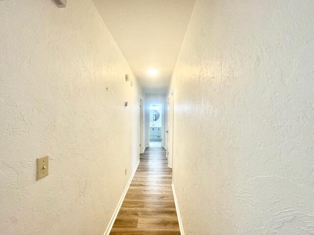 708 Caribbean Way Niceville, FL 32578 - Photo 15 of 34 a view of a hallway with wooden floor
